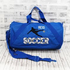 With a black and white soccer print for SOCCER, this bag is ready to hold all your stuff whether for after school practice, competitions or even a weekend at grandma's! Add a name for a super personalized bag. The HMTO Guarantee: Hand Made To Order means this product is not premade, so this item will be unique and hand crafted just for you! Current Production Times. THREE GREAT STYLES: TOTE bag measures 12x18"with a zippered top. SMALL barrel duffle bag measures 18”x10”x10”, with a side zippered Sporty Personalized Sports Bag, Black Bags For Sports With School Spirit Style, Personalized Sporty School Bag, Sporty Personalized School Bag, Blue School Spirit Bags For School, Personalized Sporty Bags For Sports Events, Customizable Sporty School Bags, Sporty Personalized Bag For Sports Events, Rectangular Sports Bags For Back To School