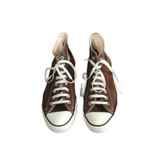 a pair of brown sneakers with white laces