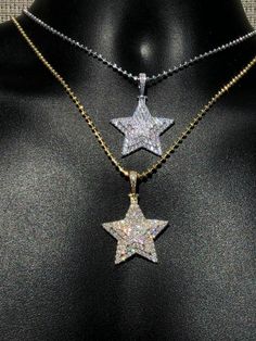 "Custom made super iced out STAR PENDANT. Made from 100% Solid 925 Sterling silver and finished in your choice of either Rhodium or 14k yellow gold. Adorned with 200 micro paved simulated diamonds (CZ) to give this piece an amazing super icy look! Measures approximately 1.25\" x 1.25\" and weighs approximately 8 grams. You can buy pendant only or with choice of 18-30\" 2.5mm diamond cut ball moon chains IF YOU WANT PENDANT ONLY, SELECT \"0\" Chains are also solid sterling silver and come with a Dazzling Star-shaped White Gold Necklace, Dazzling Star Shaped White Gold Necklace, Dazzling White Gold Star Necklace, Dazzling Star-shaped Sparkling Jewelry, Gold Iced Out Jewelry For Gift, Dazzling Sparkling Star Jewelry, Gold Iced Jewelry Gift, Sparkling Star-shaped White Gold Jewelry, Sterling Silver Star Necklace With Sparkling Details