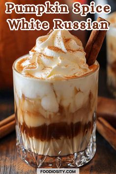 pumpkin spice white russian with whipped cream and cinnamon on the top in a glass mug