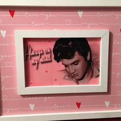 elvis presley framed in pink with hearts on the wall