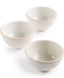 three white bowls sitting next to each other