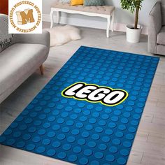 a blue rug with the word lego on it in front of a couch and chair