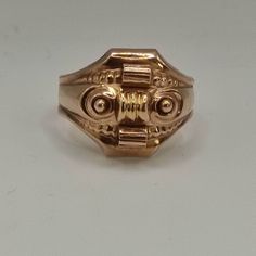 This is an antique ring from the Biedermeier period. The face of the ring is hollow worked as it was common for Biedermeier jewelry.  It's 8k gold. Very unusal! The ring look a little bit like a tank ring or an asian dragon mask to me. Inner diameter is 20mm Approx. size: US 10, UK U 1/2, German 63 It's resizeable! Weight: 4,10gr The pictures are a part of the description & they are enlarged for a better description! Please also have a look at wearing pictures and the dimensions!  The boxes in t Antique Engraved Ring With Decorative Band, Antique 14k Rose Gold Rings, Collectible Gold Rings With Historical Design, Victorian Rings With Decorative Band For Formal Events, Victorian Rose Gold Hallmarked Ring, Antique Ceremonial 14k Gold Rings, Victorian Rings With Historical Design For Ceremonial Occasion, Antique 14k Gold Ceremonial Rings, Antique Yellow Gold Ceremonial Rings