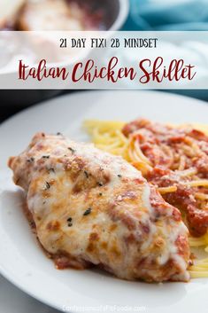 a white plate topped with pasta and meat covered in sauce next to a skillet