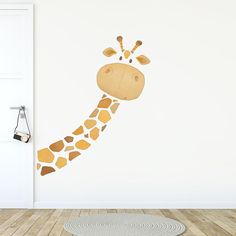 a giraffe's head is painted on the wall