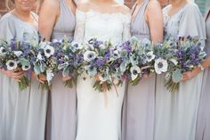 the bride and her bridesmaids are holding their bouquets