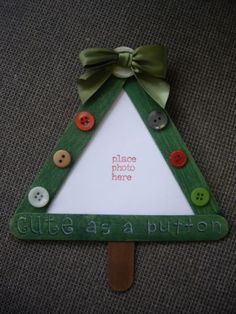 a christmas tree shaped card with buttons on it