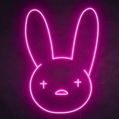 a neon sign with a bunny face and cross on it's chest in front of a dark background