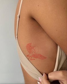 a woman with a tattoo on her back