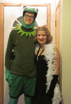 a man and woman dressed up in costumes