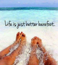 two people laying on the beach with their feet in the water and one is saying life is just better barefoot