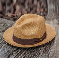 Similar to the Black Bow Band on White Panama Hat also from the Austral Hats line, this hat has a short brim and tear drop style crown accented in a bowed band. This hat comes with a brown band and cafe tan colored genuine panama straw hand woven from 100% Toquilla straw. *Stylish, lightweight, and comfortable. *Snap Brim - Turn up or down for your own style Mens Summer Hats, Mens Straw Hats, Mens Dress Hats, Upf Clothing, Trending Hats, Outback Hat, Mens Hats Fashion, Western Hats, Hat Band