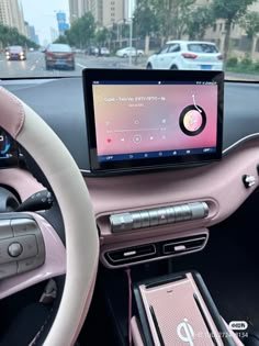 a car dashboard with an electronic device in the center