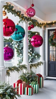 christmas decorations hanging from the front porch