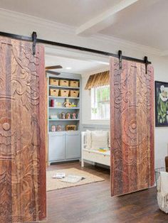 an open living room with sliding doors in it