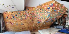 a large wooden boat with lots of different colored sprinkles on it's side