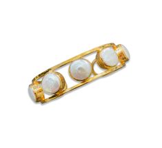 Discover the exquisite Byzantine Pearl Cuff, a remarkable testament to craftsmanship. This bracelet is lovingly handcrafted in the USA by a talented mother-daughter duo from Handmade Chakarr Jewelry. It features five stunning pearl stones, delicately cradled in bezel settings and adorned with a gleaming gold-plated finish. Made in USA. Luxury Bangle With Bezel Setting As Gift, Luxury Gift Bangle With Bezel Setting, Wedding Bangle Bracelet With Cabochon, Elegant White Gemstone Cuff Bracelet, Elegant Cabochon Cuff Bangle Bracelet, Elegant Cabochon Cuff Bracelet For Formal Occasions, Elegant Cuff Bracelet With Cabochon For Gifts, Pearl Cuff Bracelet, Pearl Cuff