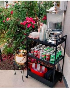 an outdoor bar cart with drinks on it