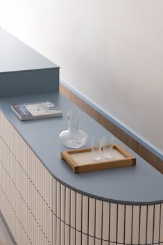 a tray with glasses on top of a counter