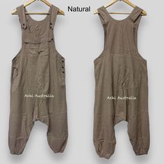 Our Unique hippie overall is a comfortable, easy to wear Dungarees style piece. Perfect for warmer weather, this hippie Overalls is a fun piece designed to be functional as well as stylish. It comes in 4 different sizes S,M, L XL and unique colours.   Features :-         *100% cotton fabric and handmade in Nepal.   * Adjustable length coconut buttons on                shoulders   * Relaxed fit    *wooden buttons         * Two side pockets and one chest pocket with     button.    *Elastic cuffs a Summer Utility Cotton Overalls, Cotton Overalls With Side Pockets, Bohemian Overalls With Pockets For Spring, Khaki Cotton Jumpsuits And Rompers For Fall, Casual Sleeveless Jumpsuits And Rompers For Festival, Bohemian Relaxed Fit Overall Jumpsuit, Bohemian Cotton Jumpsuits And Rompers With Relaxed Fit, Sleeveless Cotton Utility Jumpsuits And Rompers, Bohemian Cotton Overalls For Spring