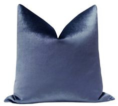 a blue pillow on a white background