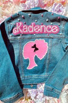 a jean jacket with the word radelancee on it and a pink silhouette