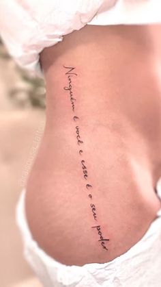 a woman's stomach with the words written in cursive writing on it