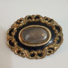 Antique Victorian Morning Brooch With Crystal Cover Over Hair Work Design, Has An Interesting Metallic Spiral Tie Holding The Hair. Has Wear On Crystal Cover, C Clasp On Back. Also Has A Ring Added For Hanging As A Pendant. Sterling Silver Back With Gold Filled Scroll Work On Front. Questions? Leave A Comment Below! Victorian Hair, Victorian Hairstyles, Scroll Work, Work Design, Pendant Gold, Hair Art, Antique Victorian, Gold Pendant, Gold Filled