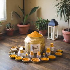 a large pot with lots of yellow stuff in it on top of a wooden floor