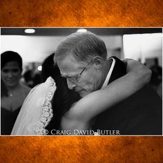 an older man and woman embracing each other