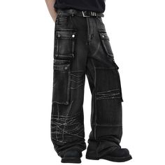 Black wide-leg jeans with a dramatic oversized silhouette. Features multiple large cargo pockets with snap button closures, adding a utilitarian edge. The jeans have a unique distressed design with white embroidered barbed wire patterns across the legs, creating an edgy, punk-inspired look. The denim has a worn, faded black wash for a vintage feel. The extreme wide-leg cut and long length result in a floor-sweeping hem. Combines avant-garde styling with gothic and industrial aesthetics for a bol Punk Style Wide Leg Jeans, Edgy Baggy Wide Leg Cargo Jeans, Baggy Grunge Cargo Jeans With Multiple Pockets, Edgy Wide Leg Cargo Jeans For Streetwear, Baggy Punk Cargo Jeans For Streetwear, Edgy Baggy Distressed Cargo Jeans, Edgy Distressed Baggy Cargo Jeans, Distressed Baggy Cargo Jeans In Edgy Style, Distressed Baggy Cargo Jeans With Edgy Style