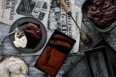 chocolate cake and ice cream are sitting on the table next to each other in pans