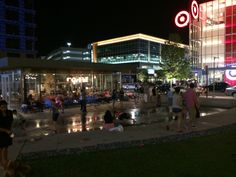 many people are walking around in the city at night