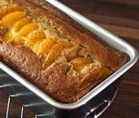 a loaf of bread sitting on top of a metal rack