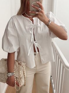 Introducing the luxurious Rosa Clothing Tie Front Puff Sleeve Blouse. Crafted from high-quality polyester, this stylish blouse features a feminine bow tie front and playful short sleeves. Elevate your wardrobe with this tasteful and exclusive piece. Bust Length Shoulder S 39.37 21.26 18.50 M 40.94 21.65 18.90 L 42.52 22.05 19.29 Front Tied Shirt, Summer Puff Sleeve Top With Short Sleeves, Trendy Puff Sleeve Short Sleeve Top For Summer, Spring Feminine Puff Sleeve Top With Short Sleeves, Trendy Summer Short Sleeve Puff Top, Spring Feminine Puff Sleeve Top, Trendy Puff Sleeve Top For Summer, Summer Puff Sleeve Short Sleeve Top, Summer Short Sleeve Puff Top