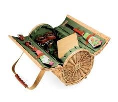 a wicker picnic basket filled with food and utensils on a white background