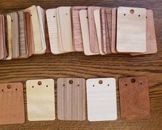 wooden tags are lined up on a table