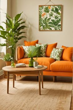 a living room with an orange couch and green plants on the wall, coffee table