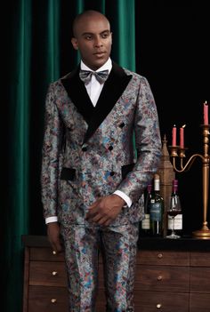 This regal three-piece tuxedo for men or women is a balance of character, charm and individuality. With a bold colorful design, this grey based suit can partner with endless options making it an effortless choice for weddings and other formal events. FREE SHIPPING ON ORDERS OVER $199 COLOR Multi-Color COMPOSITION N/A YARN COUNT N/A WEIGHT 290g FABRIC STYLE Jacquard OCCASION Wedding/Gala Formal Men, Formal Men Outfit, Custom Clothing, Tuxedo For Men, Grown Man, Man Style, Cuffed Pants, Suit Style, Black Men Fashion