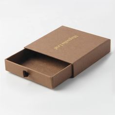 an open cardboard box on a white surface