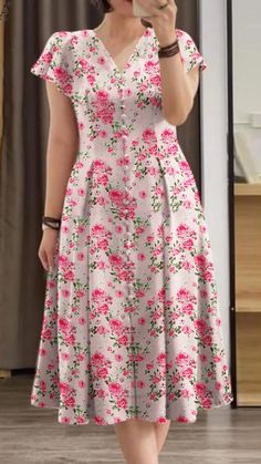 I stumbled upon this stunning Elegant Floral Dress, and I can't stop thinking about it! The short sleeves and bohemian print are perfect for summer parties.   I can already picture myself twirling on the dance floor in this beauty!   Have you seen a dress that made you feel this way? I'd love to hear your thoughts in the comments! 🌸✨   #FloralDress #SummerStyle #BohemianVibes #FashionInspo #DressToImpress Flowery Dress Casual, Frocks For Women Party, Summer Frocks, Elegant Floral Dress, Flowery Dress, Floral Print Dresses, Long Frock Designs, Long Gown Design