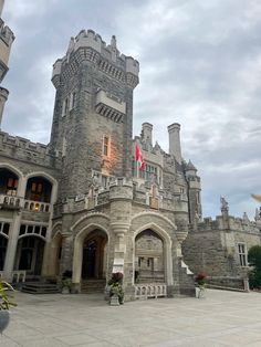 a large castle like building with a flag on top