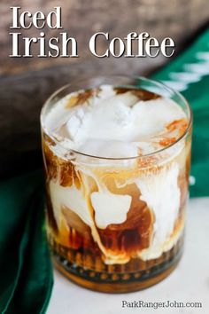 iced irish coffee in a glass with ice on the rim and topped with whipped cream