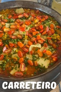 a pan filled with lots of food on top of a stove