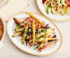 there are many different types of vegetables on the plates next to each other, including carrots and radishes