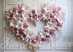 paper flowers arranged in the shape of a heart