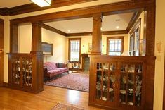 a living room filled with furniture and wooden floors