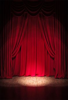 a red curtain with light shining through it