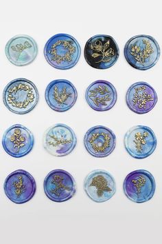 twelve blue and gold plates with designs on them